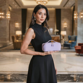 Woman holding a purple handbag in a luxurious interior setting